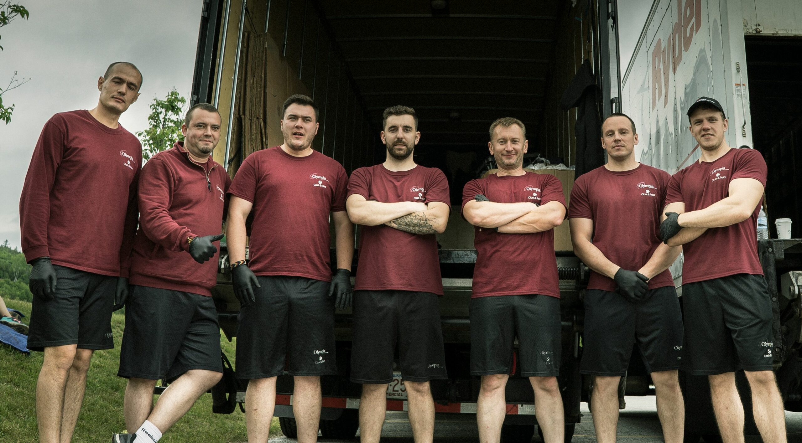 Olympia movers carrying furniture into a home
