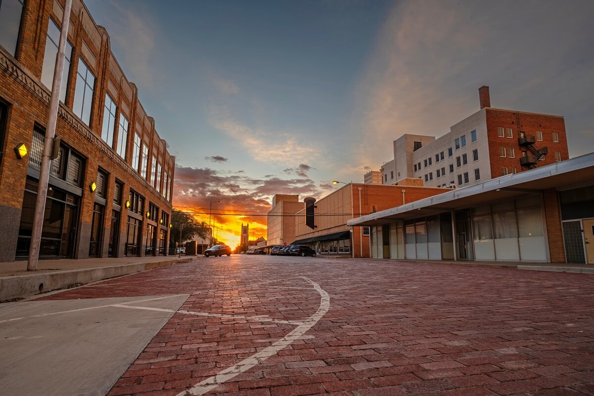 Sun setting on a old brick street in downtown