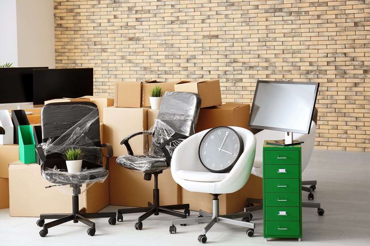 carton boxes with stuff in empty room