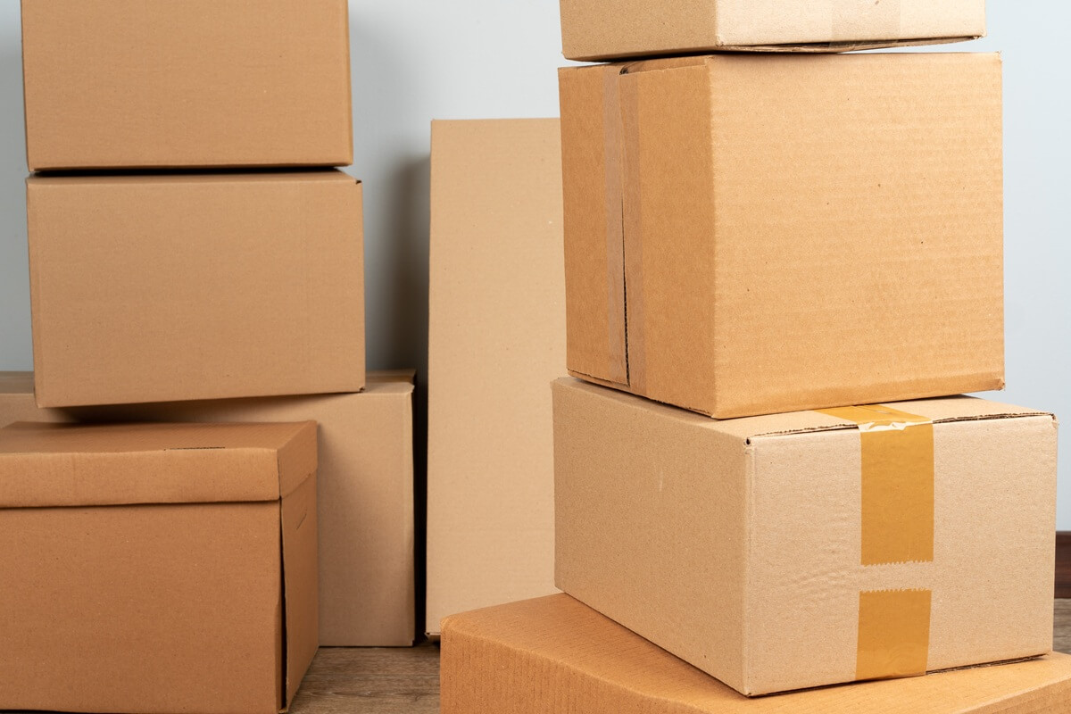 close up photo of a stack of moving boxes