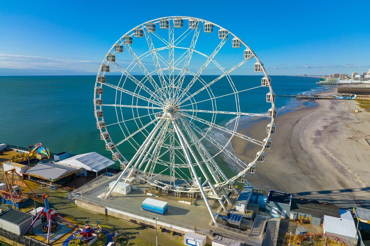 ferris wheel on steel pier next to boardwalk in Ocean City New Jersey