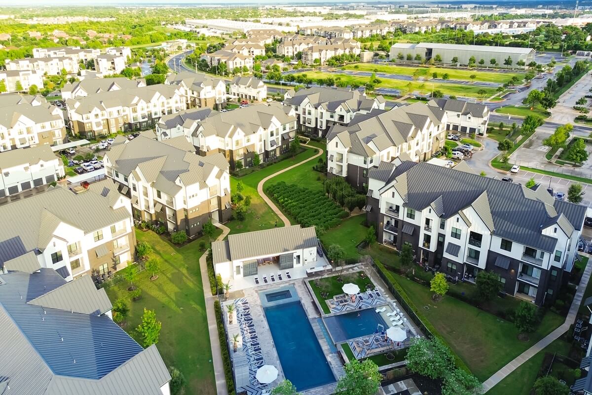 modern swimming pool and spa in new development apartment complex with metal roofing Pflugerville Texas