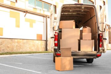 open car trunk with moving boxes outdoors