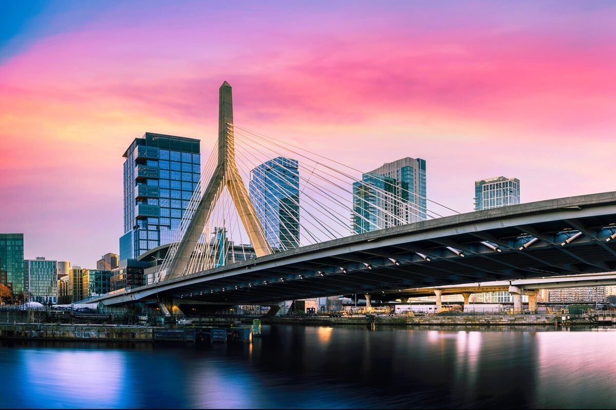 zakim bridge and Boston city skyline over the charles river at sunset in Boston Massachusetts